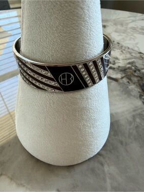Silver-Tone Black Enamel Crystal Logo Bangle
HENRI BENDEL